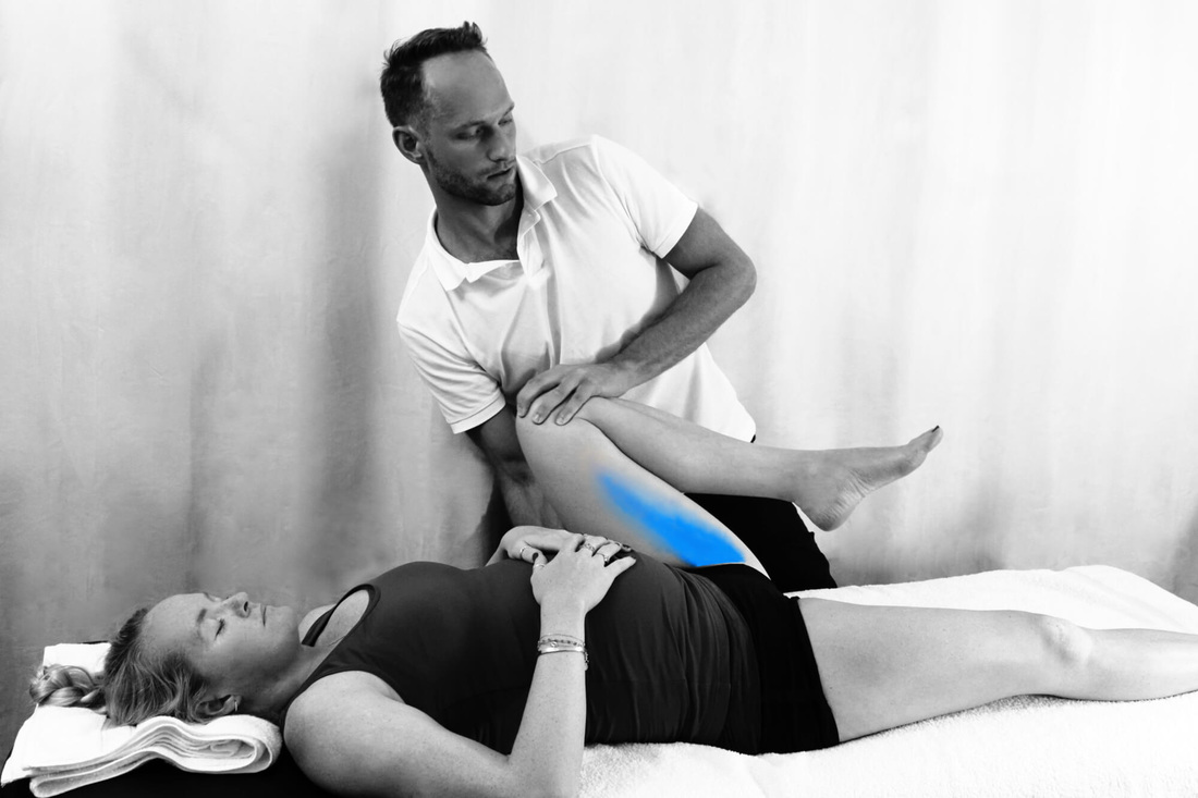 Osteopath Dr Christoph Datler examining the hip joint of Olympian Shauna Mullin during her pregnancy. Hip, groin and lower back pain can be common during pregnancy and is mostly related to the postural changes and musculoskeletal compensations